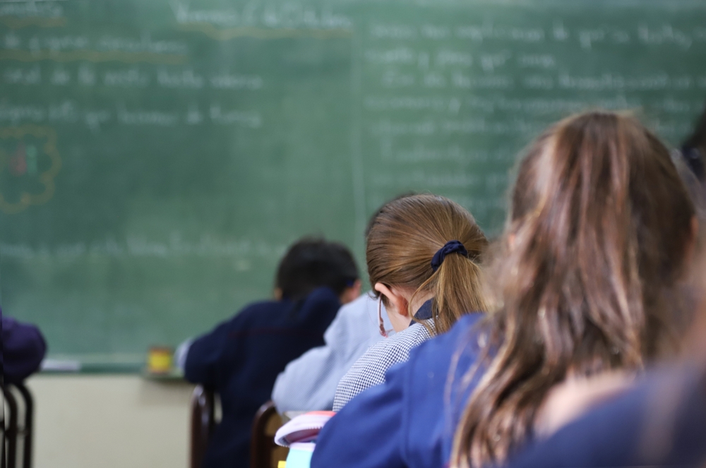 Students,In,Class,Copying,Text,From,The,Blackboard.,Classroom,With
